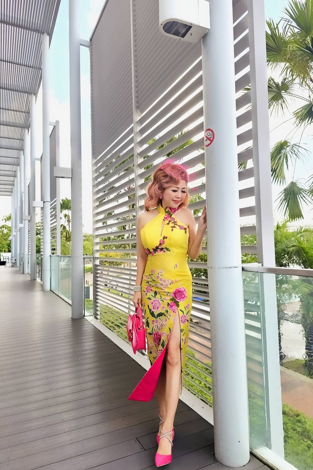 Celestia Faith Chong in a yellow floral cheongsam.